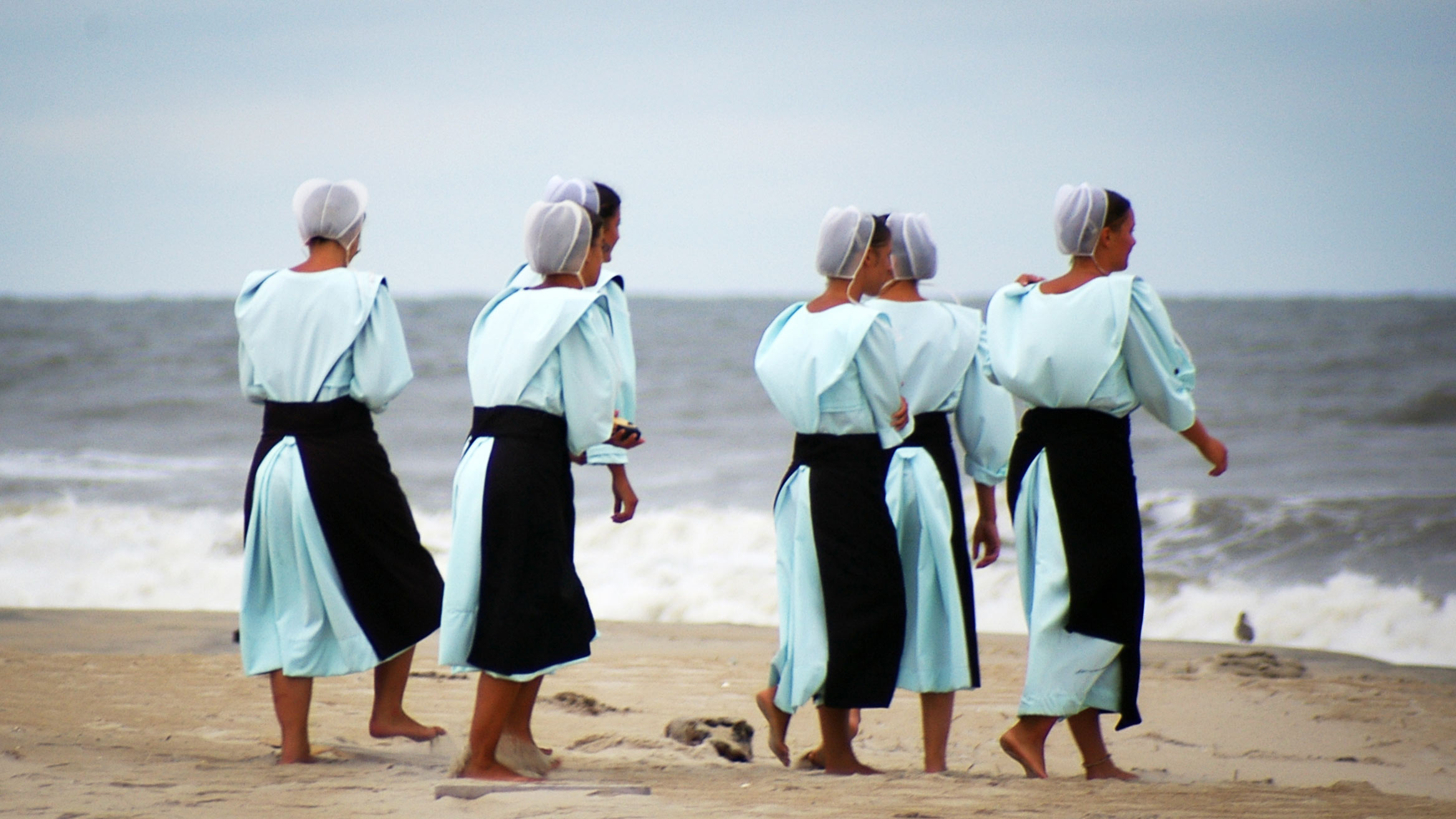 Amish women at the beach in Chincoteague, Virginia. 